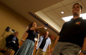 Author J.F.Penn holds a gun on Marine Jack Hoban at Thrillerfest 