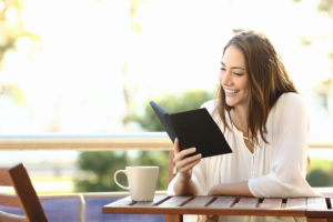 Woman Relaxed Reading A Book In An Ebook