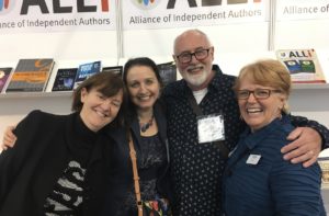 Orna Ross, Joanna Penn, David Penny, and Robin at the Alliance of Independent Authors stand LBF 2018