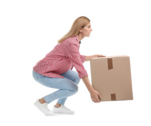 woman lifting a box