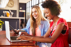 Two women with laptop