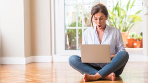 surprised woman with laptop