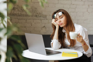 tired woman with laptop