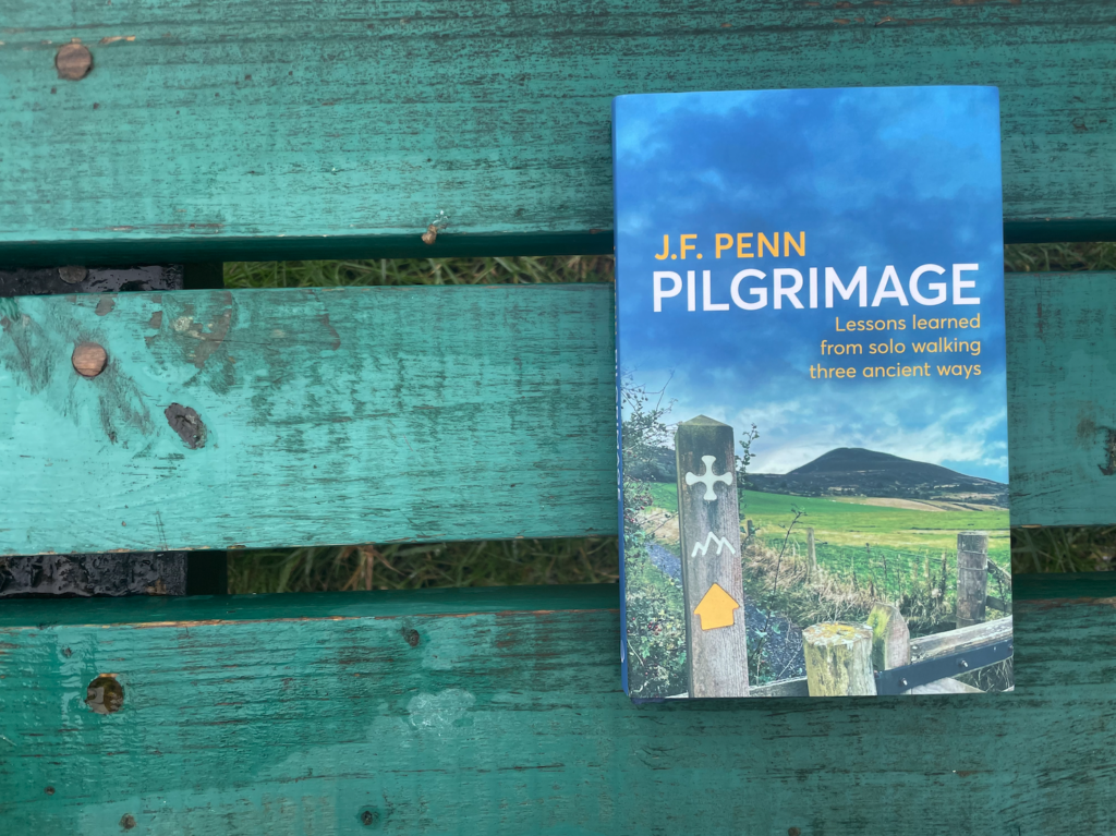 Pilgrimage book on green bench